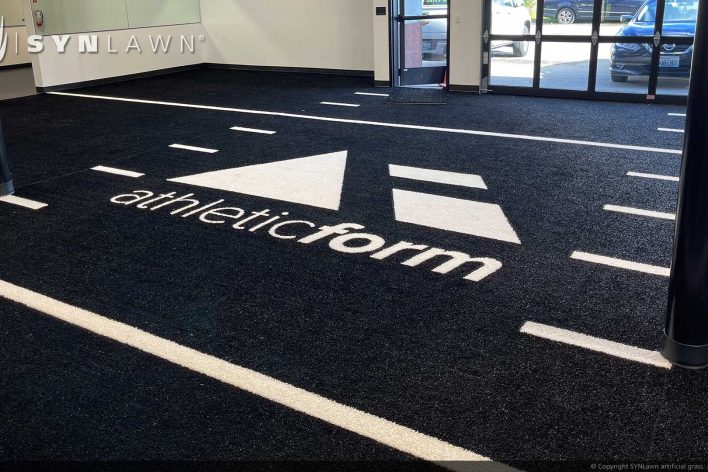 image of SYNLawn Calgary CA prefab turf logos for athletic weight room applications